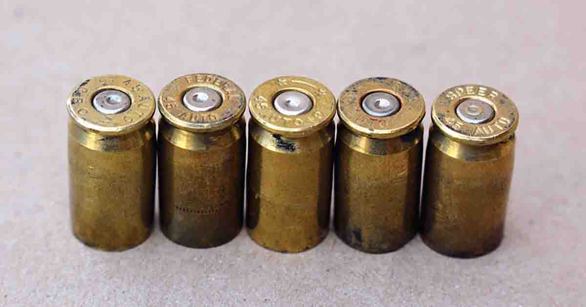 Primers with a flattened firing pin indention (in the .45 ACP) is the result of overly large flash holes and not excess pressure, such as can be seen with the Speer case on the right.